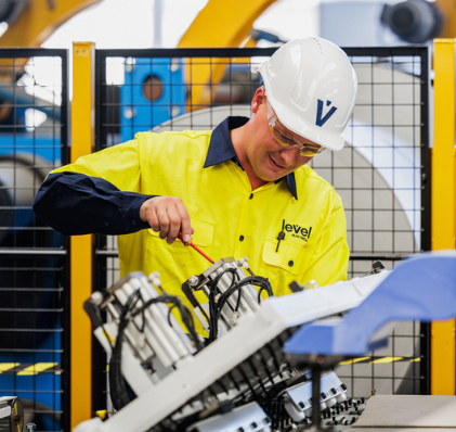 Level Electrical Hume technician performing industrial electrical maintenance in Canberra, representing local capability backed by national strength.
