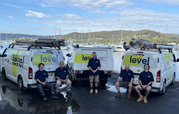 Level Electrical & Air West Gosford electricians with branded service vehicles, providing electrical services across the Central Coast.