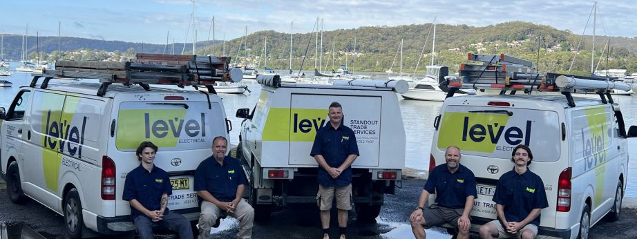 Level Electrical & Air West Gosford electricians with branded service vehicles, providing electrical services across the Central Coast.