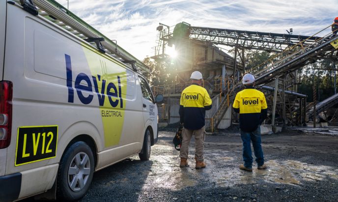 Level Electrical Taree team onsite at the Possum Brush hard rock crushing plant, standing beside a branded service vehicle during the MCC and automation upgrade.