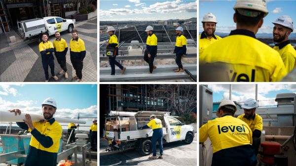Level Plumbing Canberra team onsite at the Nishi building in Canberra’s NewActon precinct, delivering complex siphonic drainage upgrades for Built using the Geberit roof drainage system.