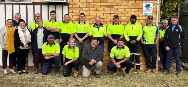 The Level Plumbing Tamworth team standing together outside their Tamworth office.