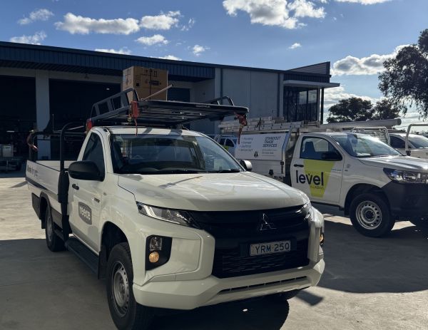 Reece and Level Plumbing Australia utes on site