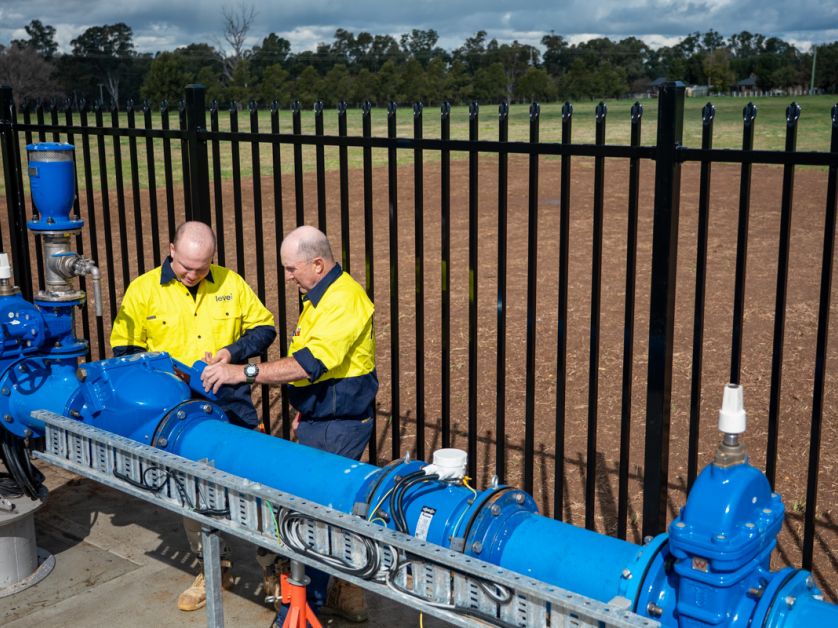 Level plumbers inspecting and repairing large commercial water pipeline system in Australia