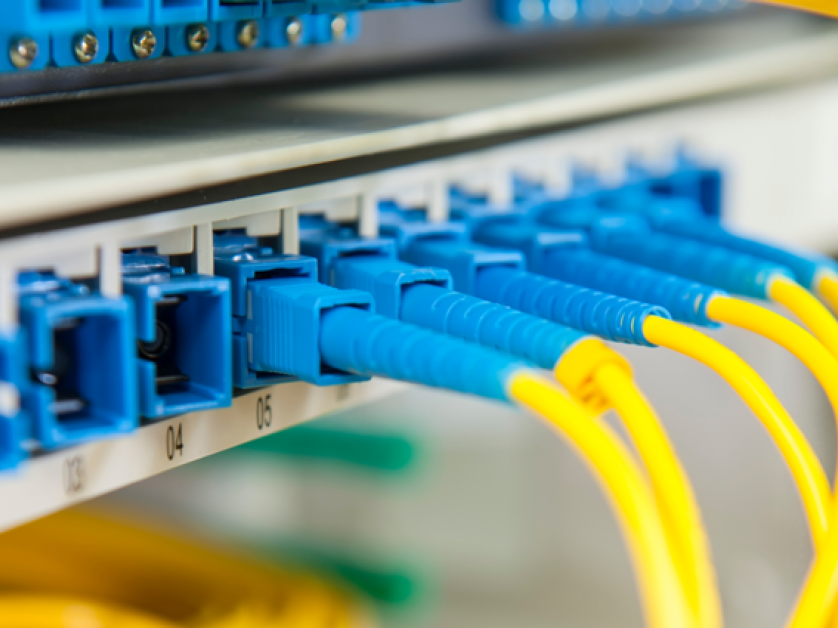 Fibre data cables connected to a network patch panel for structured cabling and network infrastructure