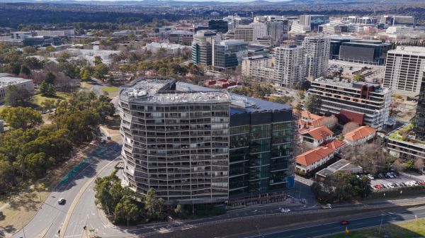 Aerial view of the award-winning Nishi Building in Canberra, featuring Level Plumbing Canberra’s work delivering complex hydraulic and plumbing systems for a large-scale sustainable development.