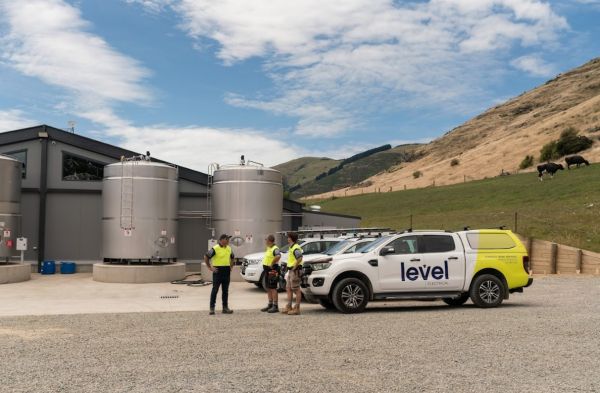 Level Electrical Ashburton team and vehicles at Wongan Hills dairy shed installation in Banks Peninsula