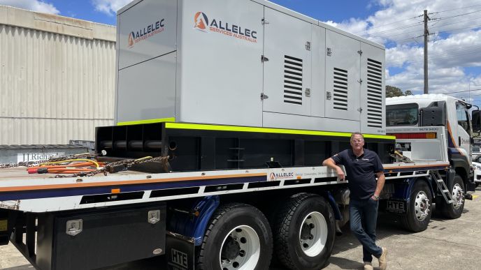 Allelec Services Australia generator being transported on a truck for a commercial electrical project in Sydney.