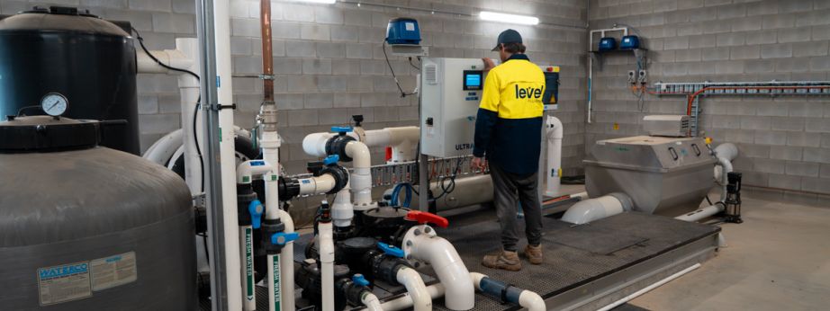 Level plumber inspecting and maintaining commercial water infrastructure and pipe systems in Australia