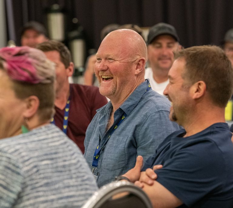 Level Members attending a conference business session and listening to speakers during the Next Level Conference