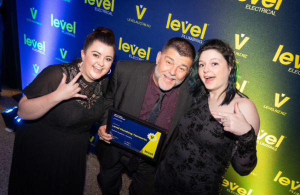 Peter Dillon from Level Plumbing Tamworth with Sally Young and his daughter at the Level Awards.
