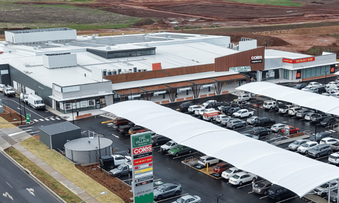 Aerial view of the completed Village Southlakes shopping center featuring Coles, specialty stores, and customer parking in South Dubbo.
