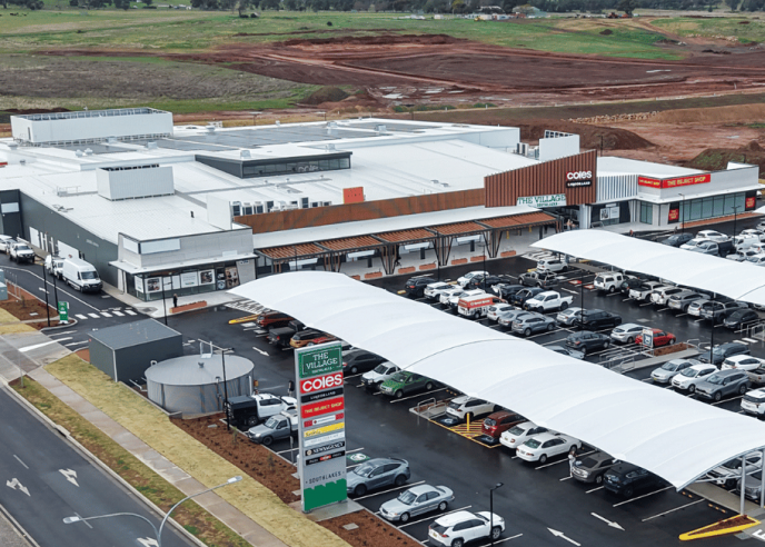Aerial view of the completed Village Southlakes shopping center featuring Coles, specialty stores, and customer parking in South Dubbo.