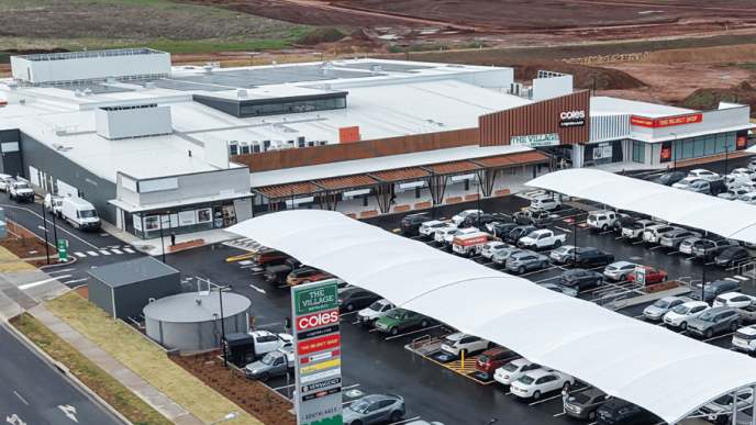 Aerial view of the completed Village Southlakes shopping center featuring Coles, specialty stores, and customer parking in South Dubbo.