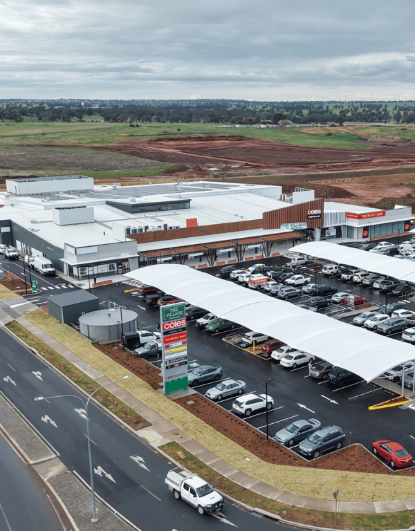 Aerial view of the completed Village Southlakes shopping center featuring Coles, specialty stores, and customer parking in South Dubbo.