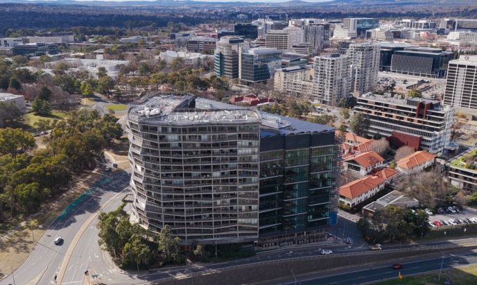 Aerial view of the award-winning Nishi Building in Canberra, featuring Level Plumbing Canberra’s work delivering complex hydraulic and plumbing systems for a large-scale sustainable development.