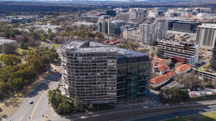 Aerial view of the award-winning Nishi Building in Canberra, featuring Level Plumbing Canberra’s work delivering complex hydraulic and plumbing systems for a large-scale sustainable development.