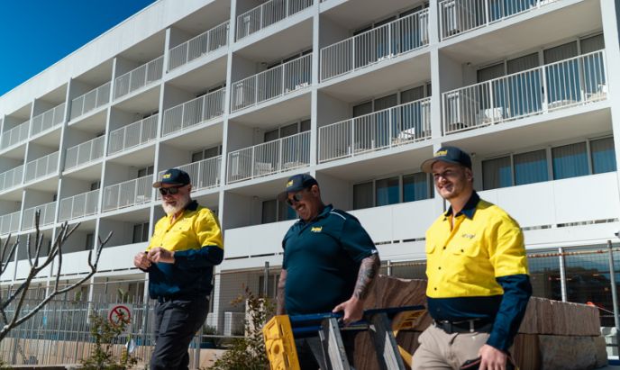 Level Electrical Newcastle Central team on site at Marina Bay Resort in Port Stephens after completing the full rewire, including lighting, power systems, and switchboard upgrades.