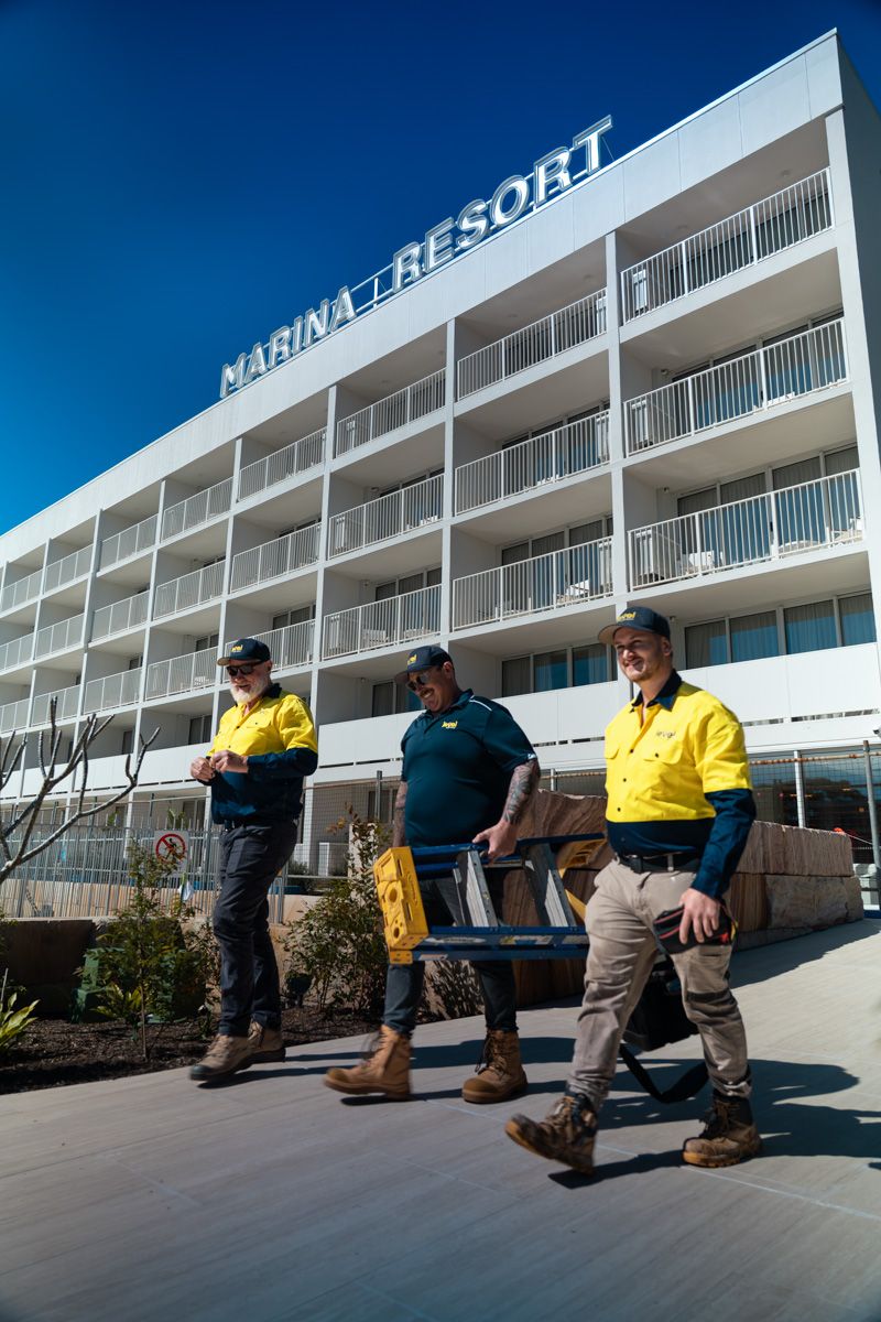 Level Electrical Newcastle Central team on site at Marina Bay Resort in Port Stephens after completing the full rewire, including lighting, power systems, and switchboard upgrades.