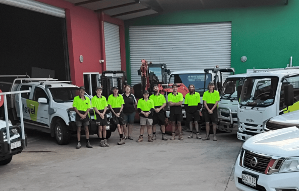 Level Plumbing Airlie Beach team with branded service vehicles, providing plumbing services across Airlie Beach, Cannonvale and the Whitsundays.