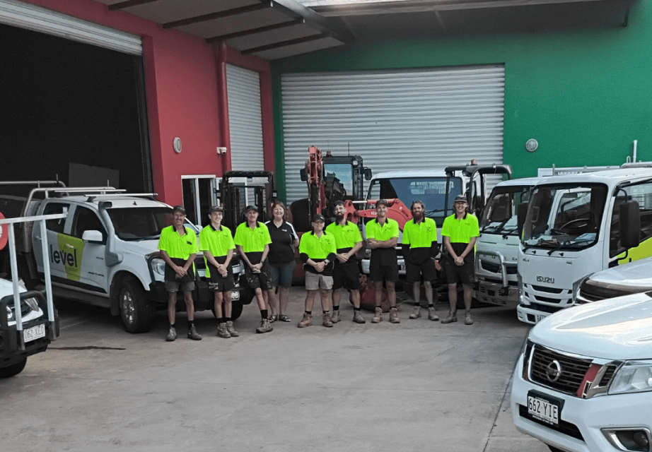 Level Plumbing Airlie Beach team with branded service vehicles, providing plumbing services across Airlie Beach, Cannonvale and the Whitsundays.