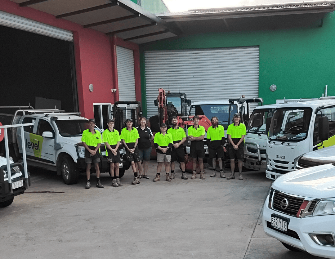 Level Plumbing Airlie Beach team with branded service vehicles, providing plumbing services across Airlie Beach, Cannonvale and the Whitsundays.