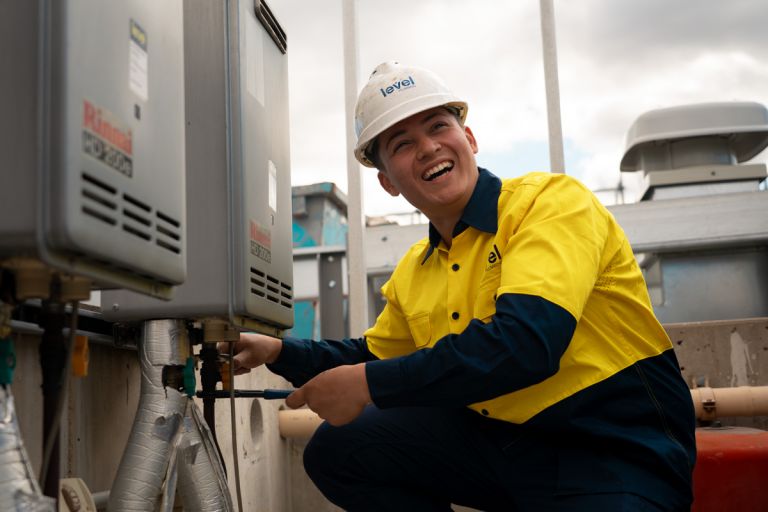 Level Plumbing Canberra technician installing a gas fitting system on site, delivering safe and compliant gas services