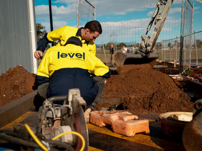 Level Plumbing Dubbo team completing commercial plumbing and civil works on a construction site in regional New South Wales, delivering large-scale infrastructure services.