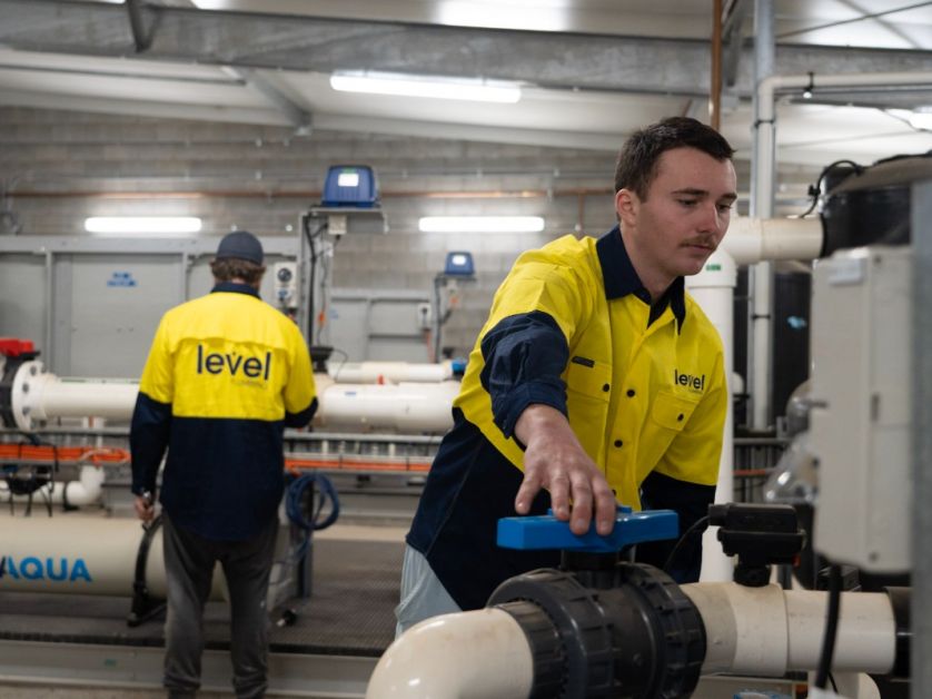 Level Plumbing Dubbo technicians inspecting advanced commercial water system to improve efficiency and sustainability