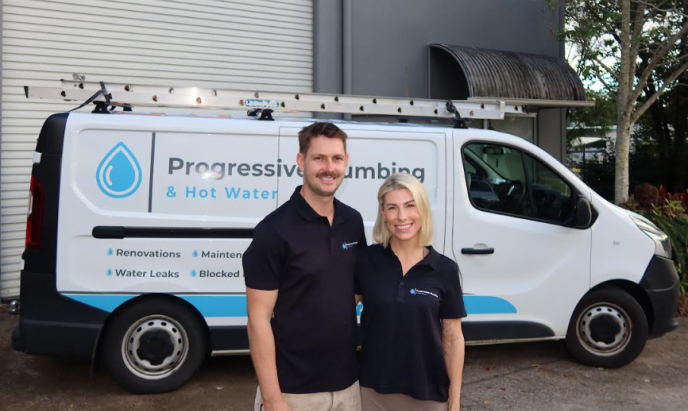 Jimmi Keller and Amelia from Level Plumbing Kunda Park standing in front of a Progressive Plumbing & Hot Water vehicle on the Sunshine Coast.