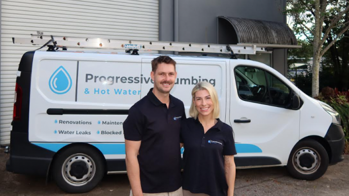 Jimmi Keller and Amelia from Level Plumbing Kunda Park standing in front of a Progressive Plumbing & Hot Water vehicle on the Sunshine Coast.